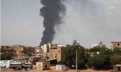  ?? Photograph: AP ?? Smoke rises over Khartoum, Sudan. The Rapid Support Forces claims to have captured a key police base in Khartoum