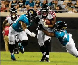  ?? SAM GREENWOOD / GETTY IMAGES ?? Falcons running back Malik Williams (35) made a strong case Thursday night by piling up 55 yards from scrimmage and scoring a touchdown.