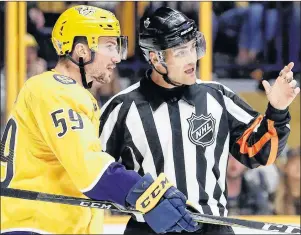  ?? AP PHOTO ?? Nashville Predators’ Roman Josi argues a call with referee Jean Hebert during an NHL playoff game against the Colorado Avalanche Saturday in Nashville, Tenn.