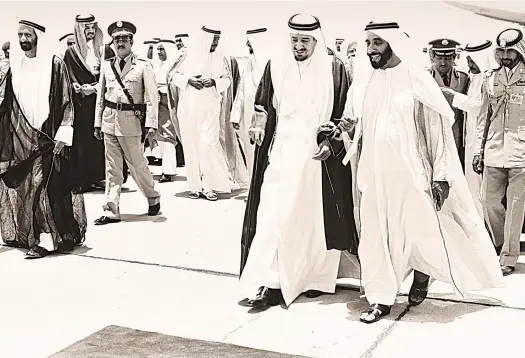  ?? National Archives ?? Sheikh Zayed, right, then leader of the UAE, welcomes Saudi King Khaled to Abu Dhabi for the 1981 GCC conference. Sheikh Rashid, then ruler of Dubai, is on the left.