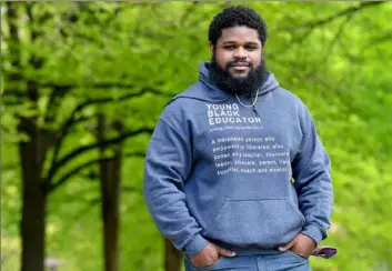  ?? Matt Freed/Post-Gazette ?? University of Pittsburgh Heinz Fellows mentor Christophe­r Darby, 29, of the Hill District, has stayed in contact with a group of 12 mentees.