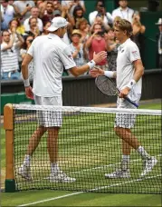  ?? CLIVE BRUNSKILL / GETTY IMAGES ?? Wimbledon will introduce a best-of-12-point tiebreaker at 12-12 for fifth sets after last year’s match between John Isner (left) and Kevin Anderson, who won the deciding set 26-24.