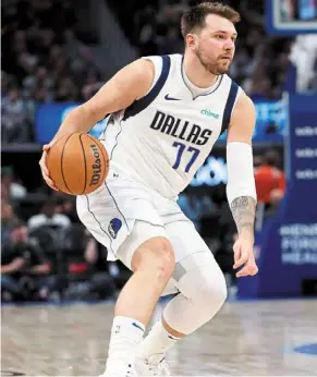  ?? ?? History maker: dallas Mavericks guard Luka doncic dribbles in the first half against the detroit Pistons at Little caesars arena on Saturday. — reuters