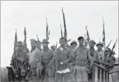  ?? LONG/AFP LE DUC ?? Khmer militants hold arms seized in a Viet Cong arms cache, at the Vietnam-Cambodia border in a photo released on June 9, 1970.