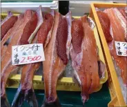  ?? JANET PODOLAK — THE NEWS-HERALD ?? Fish, shown here in a Japanese market, are not only the mainstay of Japanese diet but considered a lucky omen by cultures around the world.