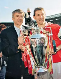 ?? ?? Highs and lows: Arsene Wenger lifts his first Premier League trophy with Tony Adams in 1998 and (below) waves goodbye 20 years later