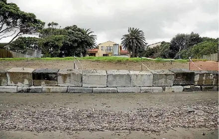  ?? PHOTO: CAMERON BURNELL/FAIRFAX NZ ?? A temporary concrete block wall at Paraparaum­u Beach, built by Kapiti Coast District Council to protect the shoreline and meant to last five years, is developing a suspicious lean.