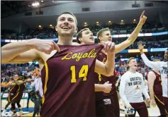  ?? ASHLEY LANDIS/TRIBUNE NEWS SERVICE ?? The Loyola Ramblers celebrate a 63-62 win against Tennessee in the second round of the NCAA Tournament on Saturday in Dallas.