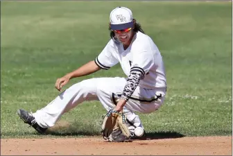  ?? Katharine Lotze/For The Signal (See additional photos on signalscv.com) ?? West Ranch’s Nicholas Balingit (13) grabs a grounder near second base during a baseball game against Moorpark on Monday. The Wildcats won the non-league game 3-0.