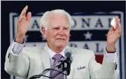  ?? AP PHOTO BY MIKE GROLL ?? In this 2010, file photo, Doug Harvey gestures after his Baseball Hall of Fame induction speech at the Clark Sports Center in Cooperstow­n, N.Y. Harvey, one of 10 umpires enshrined in the baseball Hall of Fame, died Saturday. He was 87.