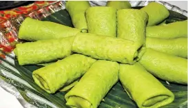  ??  ?? Dadar Gulung (Pandan leaf pancakes with jackfruit and palm sugar filling)