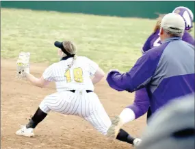  ?? MARK HUMPHREY ENTERPRISE-LEADER ?? Berryville softball coach Josh Hatfield (right) reacts, realizing Prairie Grove senior Madison Hutchinson has the ball in glove with a foot on the bag to record a force out to end the Lady Bobcats’ last at-bat and prevent them from increasing a 5-2 lead. The out involved three Lady Tigers, Sydney Stearman, who dove stopping the ball; Makinsey Parnell, who made the throw; and Hutchinson. Prairie Grove followed up the outstandin­g defense with offense, producing four runs in the bottom of the seventh to win 6-5.