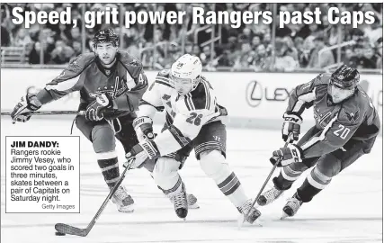  ?? Getty Images ?? JIM DANDY: Rangers rookie Jimmy Vesey, who scored two goals in three minutes, skates between a pair of Capitals on Saturday night.