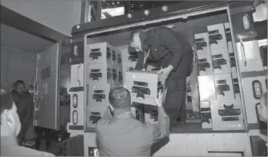  ??  ?? Workers unload Xbox One consoles from a delivery truck. (Photo: geekwire)