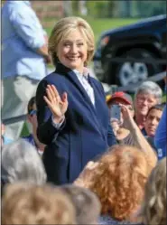  ?? NATI HARNIK — AP PHOTO ?? Democratic presidenti­al candidate Hillary Rodham Clintonwav­es to supporters­Wednesday, before speaking at a campaign stop at theWestfai­r Amphitheat­er in Council Bluffs, Iowa.