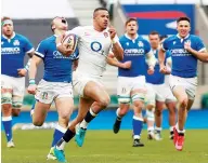  ??  ?? Intercepti­on: Anthony Watson breaks away to score England’s fourth try