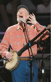  ?? EVAN AGOSTINI/AP 2009 ?? Pete Seeger has become the latest American musician to appear on a U.S. postage stamp.