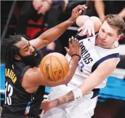  ??  ?? LUKA Doncic (right) of the Dallas Mavericks passes the ball as James Harden of the Brooklyn Nets defends during the second half of their game at Barclays Center in the Brooklyn borough of New York City Saturday. The Mavericks won, 115-98. (AFP)