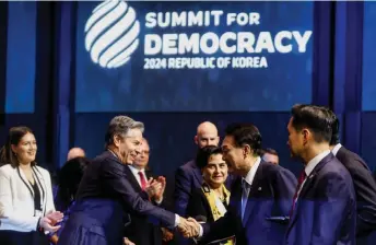  ?? — AFP photo ?? Blinken shakes hands with South Korea’s President Yoon Suk Yeol during the Third Summit for Democracy in Seoul.