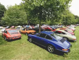  ??  ?? Top left: Just a hint of the number of cars that showed up. Remember when all new Porsches were this colourful?