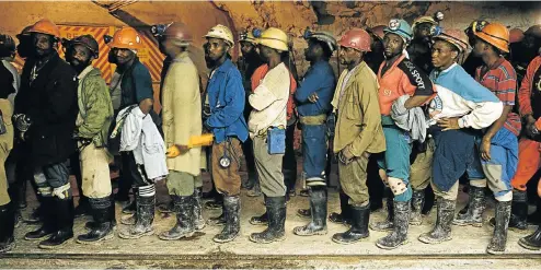  ?? Picture: Getty Images ?? Gold miners at Great Noligwa in Orkney queue undergroun­d for the lifts that will take them back to the surface at the end of their shift. The industry is hoping for greater clarity on black empowermen­t requiremen­ts when the latest Mining Charter is...