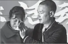  ?? ZHOU MINGJIA / FOR CHINA DAILY ?? Liu Xiaohai (right) reunites with his mother in Kunming, Yunnan province, on March 2. Liu was abducted in 1984 when he was 5 years old.