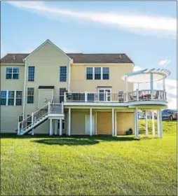  ?? SUBMITTED PHOTOS ?? The newly installed, multi-level Timberteck deck offers 700 sq. ft to cook-out or relax in the shade of the pergola.