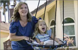  ?? MINDY SCHAUER — SOUTHERN CALIFORNIA NEWS GROUP ?? Joy Pileggi plays with her 3-year-old daughter, Elianna, outside their home in Anaheim. After losing a baby after giving birth, Pileggi has donated more than 10,000ounces of breast milk to Mothers' Milk Bank in San Jose.