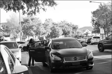  ?? STEVE MARCUS ?? A student exits a car from a traffic lane Oct. 14 on Pinewood Hills Drive in front of Becker Middle School. CCSD police remind parents that students should be dropped off at the curb.