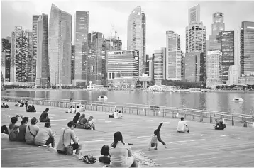  ?? — Reuters photo ?? Singapore’s external position remains a rating strength, anchored by its status as the region’s key trade and financial centre, and its ability to consistent­ly generate sizeable current account surpluses throughout the economic cycle.