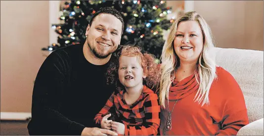  ?? JADE WARE ?? Mindy Jones, with husband, Nick, and daughter Gracelyn, has put up several Christmas trees in their new Kentucky home.