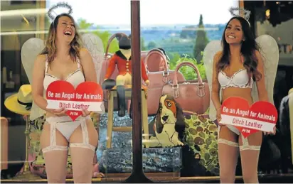  ?? Picture: AFP ?? Activists of People for the Ethical Treatment of Animals (Peta) protest against the use of animal skins at a leather goods shop in Sydney, Australia. Peta wants to raise awareness of animal welfare and to discourage the use of leather goods