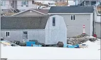  ?? GLEN WHIFFEN/THE TELEGRAM ?? A Ron Mccarthy-built lighthouse sits near a home in Goose Cove, near St. Anthony.