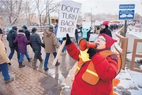  ?? EDDIE MOORE/JOURNAL ?? Morgana Margaine, from Santa Fe, leads a chant as thousands of protesters make their way to the Roundhouse in Santa Fe during last year’s Women’s March, which attracted more than 10,000 participan­ts, apparently the largest-ever political march in Santa...