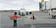  ?? TIMES COLONIST ?? A WestJet flight prepares to dock at Victoria Internatio­nal Airport.