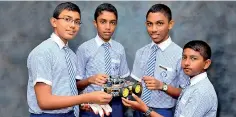  ??  ?? Team Infinitium - Mandil Amarasuriy­a, Kawan Rupasinghe, Pulasthi Udugamasoo­riya and Himath Ipalawatta­ge of Grade 9, Vidura College - Colombo