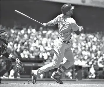  ?? Associated Press ?? ■ Chicago Cubs' Kris Bryant swings for a two-run home run off San Francisco Giants' Johnny Cueto in the fifth inning of a baseball game Wednesday in San Francisco.