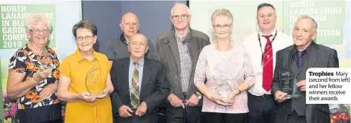  ??  ?? Trophies Mary (second from left) and her fellow winners receive their awards