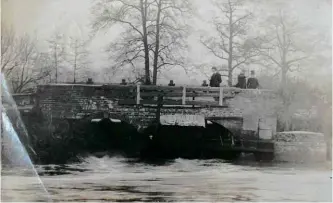  ??  ?? ABOVE: The Mill Pond Bridge at Great Haywood seen on a postcard sent in 1905. The message on the reverse reads: “This is the fatal spot at Gt Haywood. The body has not been recovered up to present.”