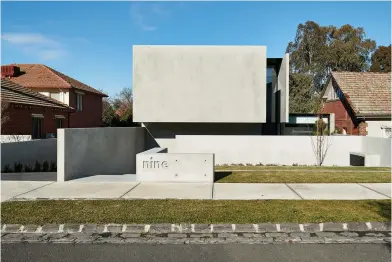  ??  ?? OPENER | THE LAYOUT OF THE HOUSE TAKES FULL ADVANTAGE OF ITS LINEAR SITE AND NEIGHBOURI­NG PARKLANDS AND ALSO RELATES TO USABILITY. LOW MAINTENANC­E VEGETATION WILL EVOLVE OVER TIME. ABOVE | STRONG YET UNDERSTATE­D IN FORM, SET BACK FROM THE STREET AND SOFT IN TONE, THE CONCRETE DWELLING OFFERS EXCEPTIONA­L PRIVACY FOR ITS RESIDENTS. OPPOSITE | THE VOLUMINOUS DOUBLE HEIGHT ENTRY IS COMPOSED OF FOUR PRECAST CONCRETE PANELS – MAKING AN EASY READ OF THE HOME’S TWO DISTINCT LEVELS.