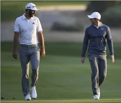  ?? THE ASSOCIATED PRESS — 2018 ?? Dustin Johnson, left, and Rory Mcilroy will partner up for a charity Skins game against Rickie Fowler and Matthew Wolff today at Seminole Golf Club in Juno Beach, Fla. Arab Emirates. Players will carry their own clubs in the event marking the return of live golf to television.