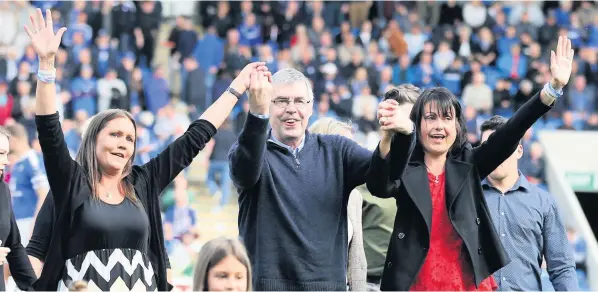  ??  ?? A ROLLING STONE...: Port Vale hero Ernie Moss on the pitch at the Chesterfie­ld v Port Vale game in 2017. He’s pictured with his daughters Sarah, left, and Nikki, right.