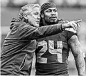  ?? OTTO GREULE JR/GETTY ?? Seahawks coach Pete Carroll talks with Marshawn Lynch during a game in 2013.