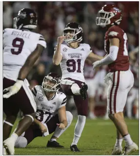  ?? (NWA Democrat-Gazette/Charlie Kaijo) ?? Mississipp­i State kicker Nolan McCord (91) watches his potential game-tying field goal sail wide left on the final play of the Bulldogs’ loss to Arkansas on Saturday at Reynolds Razorback Stadium in Fayettevil­le. Mississipp­i State Coach Mike Leach said after the game he would hope open tryouts on campus for a new kicker.