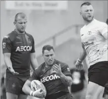  ?? ANDREW FRANCIS WALLACE, TORONTO STAR ?? Wolfpack prop Adam Sidlow, right, reacts to Whitehaven fullback Elliot Miller’s dislocated finger during first half Super 8 Rugby League play at Lamport Stadium last Saturday.