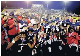  ?? ALICIA DEVINE/TALLAHASSE­E DEMOCRAT ?? Brian Dilworth (6) poses with his Chaminade-Madonna teammates after beating Florida High in the Class 3A state title game on Dec. 6, 2019. Dilworth committed to Auburn on Tuesday.