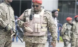  ??  ?? HEAVIES. Armed Economic Freedom Fighters members outside the Commission of Inquiry into State Capture yesterday.