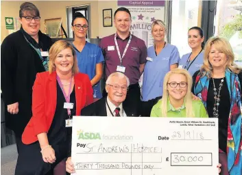  ??  ?? Gratefully received Hospice staff and capital appeal representa­tives with Kimberley Keys of Asda