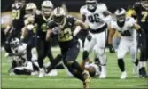  ?? BILL FEIG — THE ASSOCIATED PRESS ?? Saints running back Mark Ingram (22) runs against the Eagles in the second half in New Orleans on Sunday.