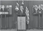  ?? MICK TSIKAS/AAP IMAGE VIA AP ?? Australian Prime Minister Scott Morrison, center, appears on stage with video links to British Prime Minister Boris Johnson, left, and U.S. President Joe Biden to announce a new security alliance that will equip Australia with nuclear-powered submarines.
